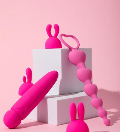 Composition,Of,Pink,Sex,Toys,With,Cubes,On,A,Pink